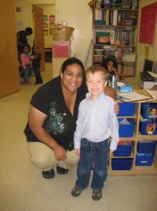 Grey in his classroom with his new TA, Melissa