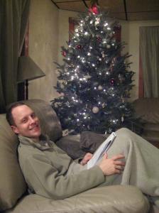 My husband in front of the tree