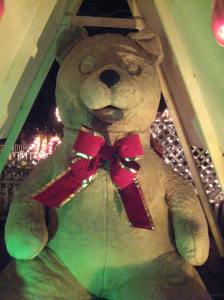 A greenish glow does not make giant teddy festive