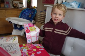 He stacks the stickers high on one small area of paper He stacks the stickers high on one small area of paper