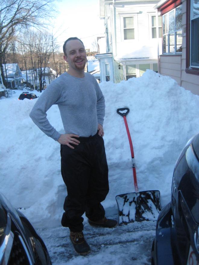 Adam stands on the drifts on the house-side of the driveway