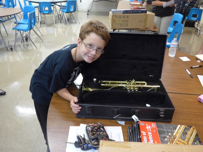 A boy and his new trumpet. OMG.