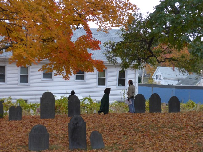 A cloaked apparition amongst the graves.