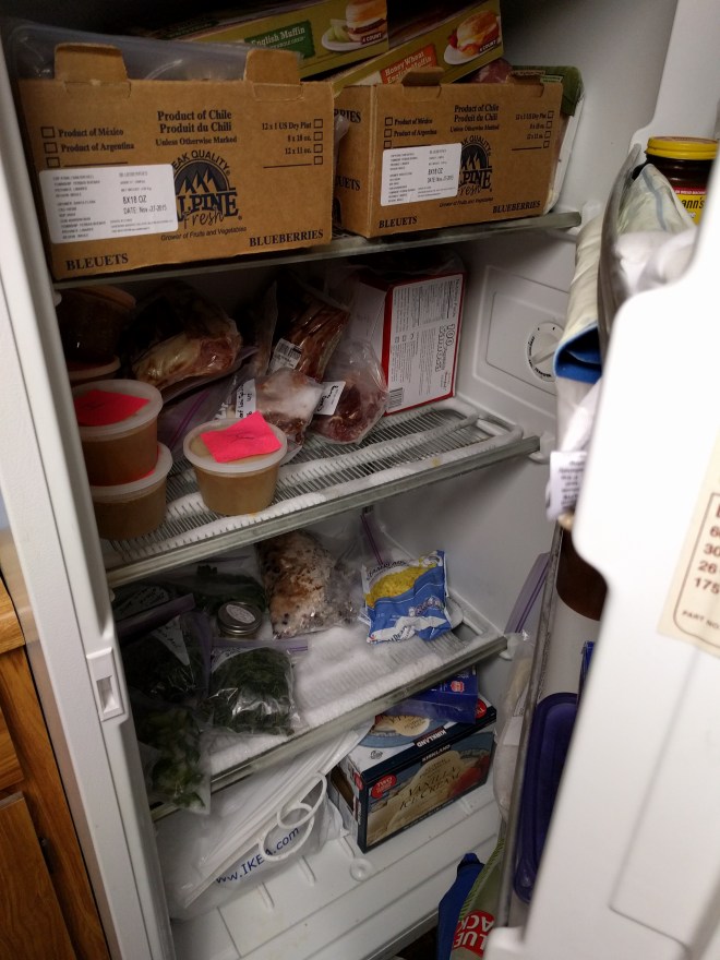 Downstairs freezer. Those cardboard boxes at the top are completely filled with meat - ground turkey, chicken breasts, pork tenderloin, and some random cuts of meat from a meat share last year