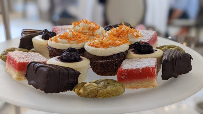 A number of very fancy small cakes and confections